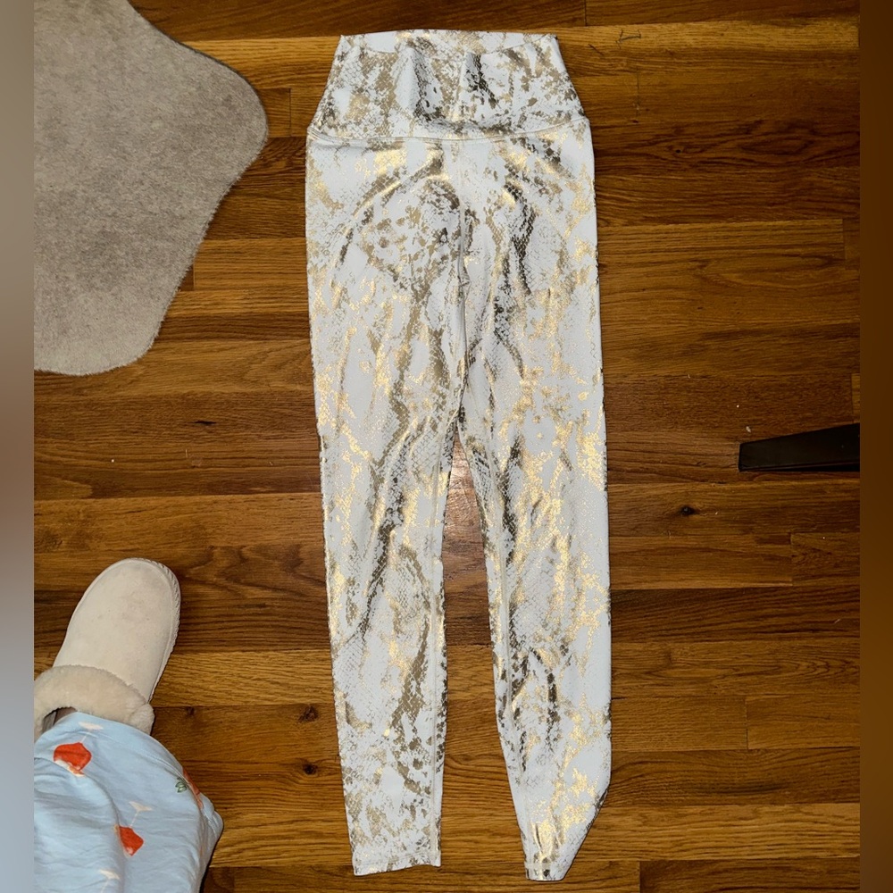 White and gold leggings, can’t remember the brand but so flattering